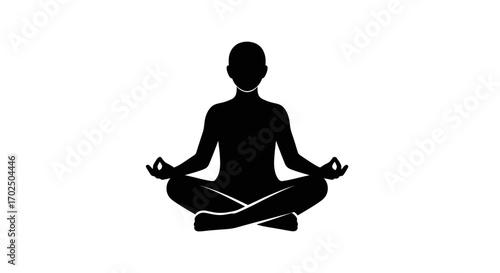 Silhouette of a person meditating in a lotus pose.