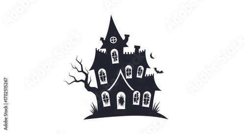 Dark silhouette of a spooky haunted house with gnarled tree.