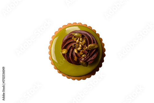Pistachio cake or tart topped with green mousse with nuts and fruit filling. Pistachio pie