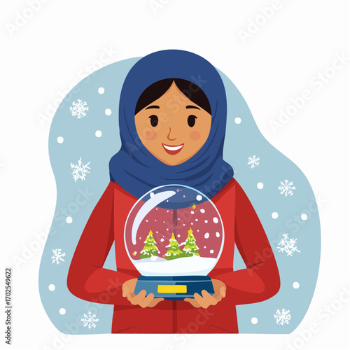 Joyful woman holding a snow globe with winter scenery, Christmas holiday spirit.