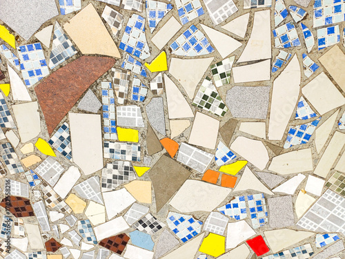 beautiful colorful mosaic floor made of broken ceramic tiles with abstract patterns. Ideal for texture background, recycled art, tile design, and creative surface concept.