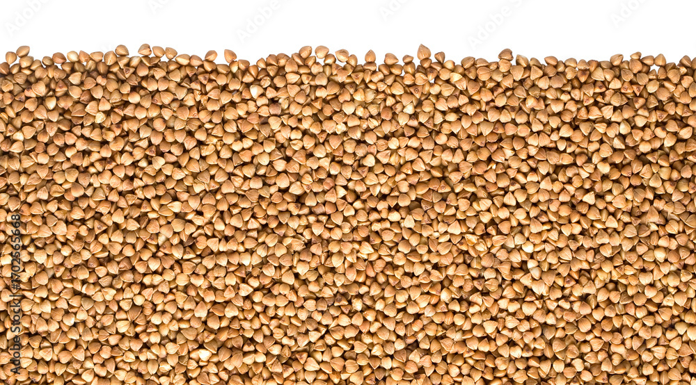 Fototapeta premium Buckwheat grains forming a textured background on transparent surface