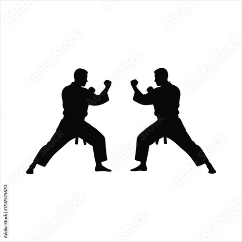 Two martial artists silhouettes facing off in combat stance ready for fight