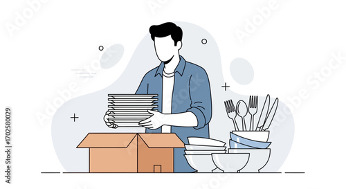 Man Packing Dishes and Cutlery Into Boxes Preparing For A New Home or Relocation