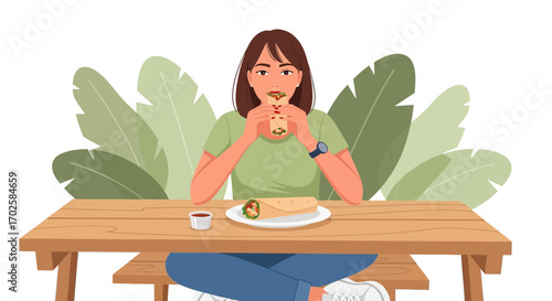 Woman Enjoying A Tasty Wrap Outdoors In A Pleasant And Relaxing Environment