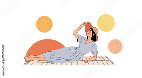 Young woman relaxing on a picnic blanket, enjoying a sunny summer day in style