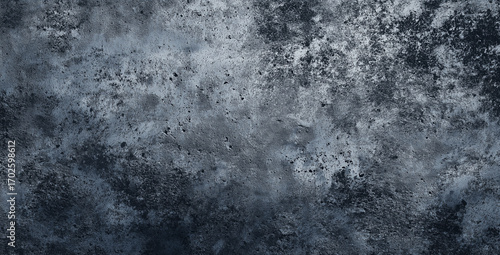 Textured grey concrete wall with detailed imperfections and artistic touch. The surface has a rough, uneven texture, showcasing an industrial or urban aesthetic.
