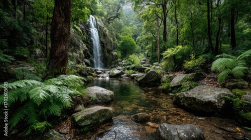 A serene natural landscape with a cascading waterfall, rocky cliff, lush greenery, ferns, shrubs,