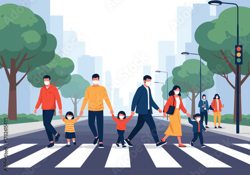 Families wearing face masks cross a city street on a pedestrian crossing during a health crisis