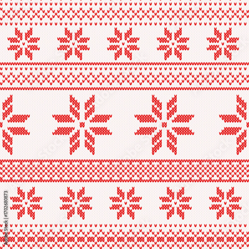 Knitted red Christmas background, ornament with snowflakes. Seamless pattern. Texture for fabric, wrapping, wallpaper. Decorative print.