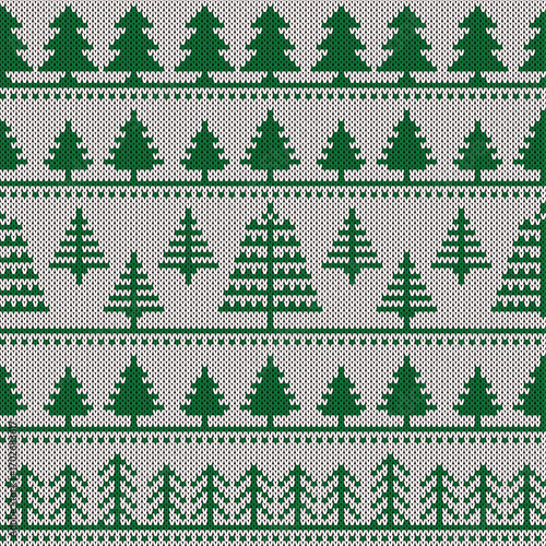 Knitted green Christmas background, ornament with christmas trees. Seamless pattern. Texture for fabric, wrapping, wallpaper. Decorative print.