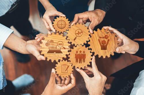This image showcases a dynamic collaboration theme with wooden gears demonstrating key business strategies including SEO metrics, teamwork, and growth initiatives. Amity