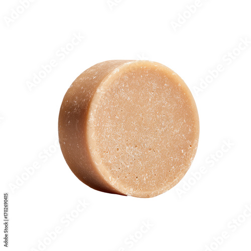 Round bar of light beige/tan soap, smooth top, textured bottom