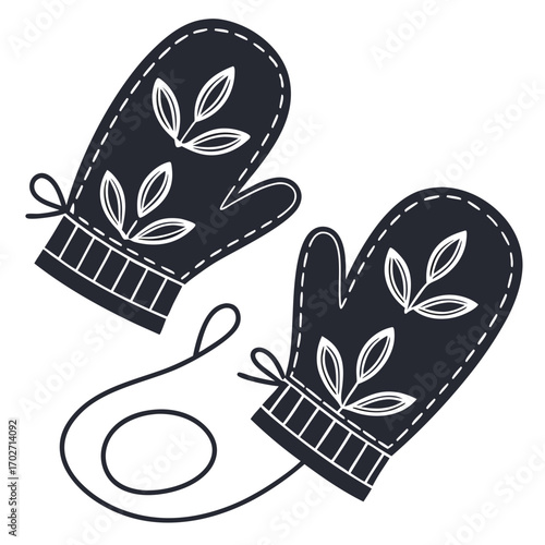 A pair of dark blue knitted mittens with white leaf patterns and a connecting string isolated on a white background symbolizing winter warmth and cozy style