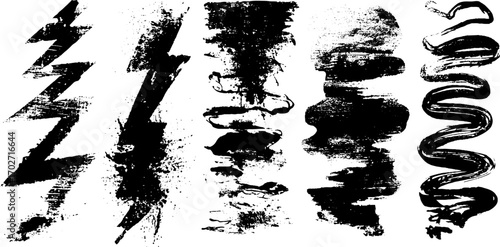 Grunge black ink symbol set with zigzag lines and lightning bolts for creative design