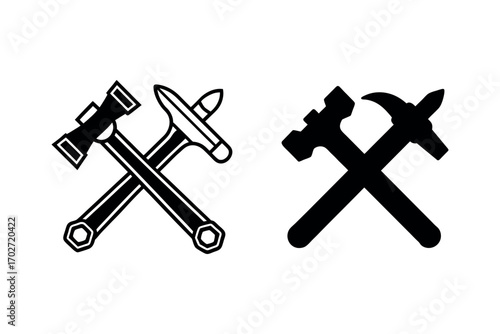 crossed tools hammer wrenches and axes depicted in silhouette