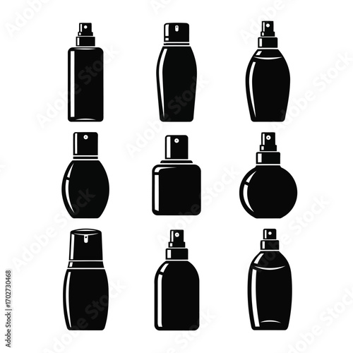 Collection of various empty cosmetic spray bottles and perfume bottles for personal care