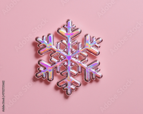 Colorful snowflake decoration on pink background.