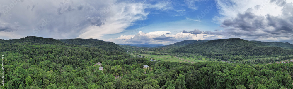 Fototapeta premium Green hills and forest landscape panorama in summer. Chynadiieve, Ukraine.