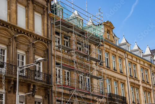 Photography Renovation of historic buildings with scaffolding, showcasing detailed architect