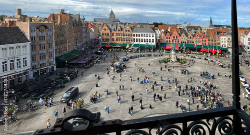 Bruges, Belgium – September 13, 2024 – Tourists in Grote Markt Square Bruges Belgium. Tourists in Grote Markt Square. The historic center of Bruges, Belgium.

