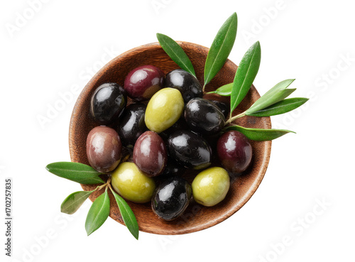 Assorted olives in a wooden bowl, topped with fresh leaves