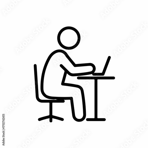 Focused person working diligently on a laptop at a desk, representing remote work and productivity.
