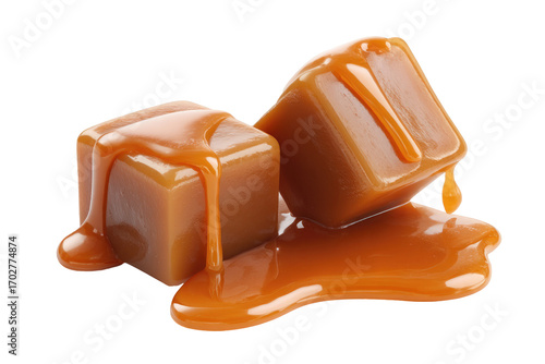 Two caramel squares dripping with melted caramel
