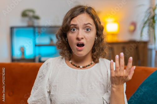 Obraz na plátně Young woman feeling hopelessness and loneliness, nervous breakdown, loses play game becoming surprised by lottery results, bad fortune, loss, unlucky news