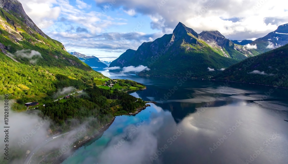 Fototapeta premium Misty fjord valley with mountains reflected