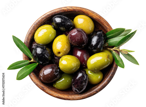 Wooden bowl brimming with assorted olives, including green, black, and purple varieties. Fresh olive leaves garnish the bowl