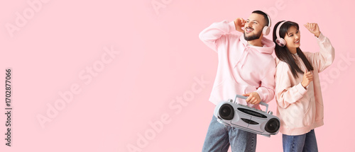 Young couple in headphones ...