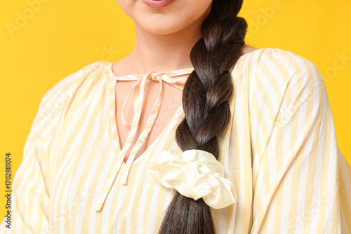 Woman with pigtail and silk...