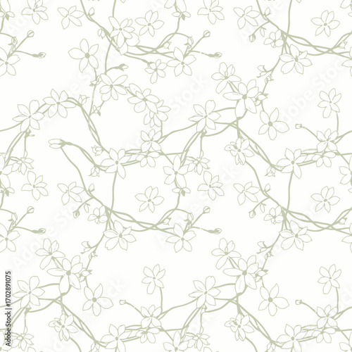 Elegant seamless pattern of delicate hand drawn light green flowers on winding branches.