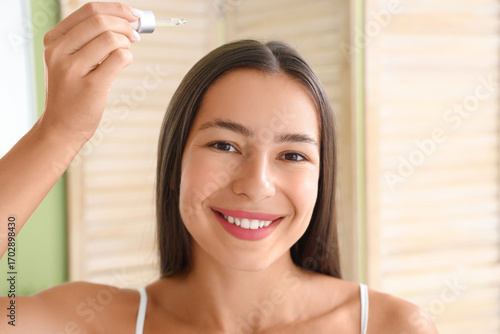 Young woman with serum for ...
