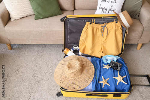 Open yellow suitcase packed...