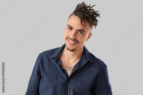 Young man with dreadlocks o...
