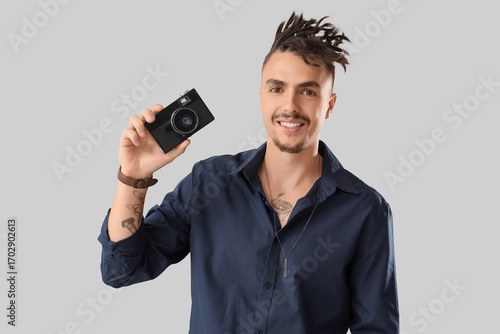 Young man with dreadlocks a...
