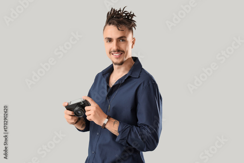 Young man with dreadlocks a...