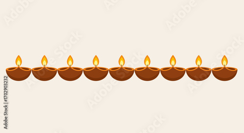 A decorative row of nine traditional Indian diya oil lamps burning brightly, celebrating the Hindu festival of Diwali.