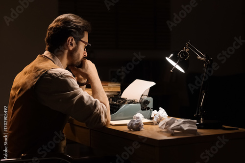 Young male writer with vint...