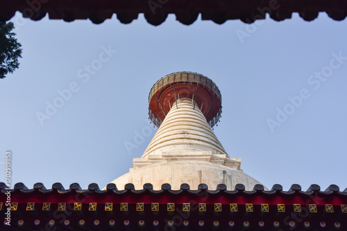 Traditional Pagoda Top Framed by Eaves Against a Clear Sky