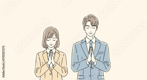 Professional colleagues praying together for success in modern business setting
