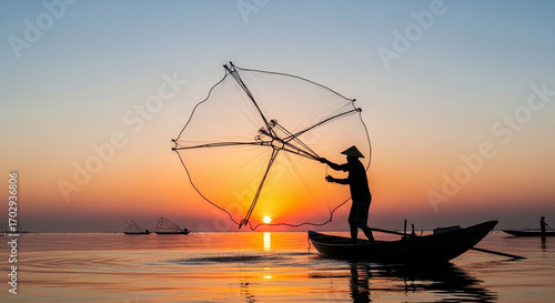 Fisherman casts net at sunrise, silhouetted against vibrant sky, traditional boat life on calm water