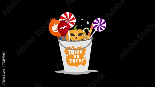 A festive Halloween trick or treat bucket overflowing with colorful lollipops and sweet candy