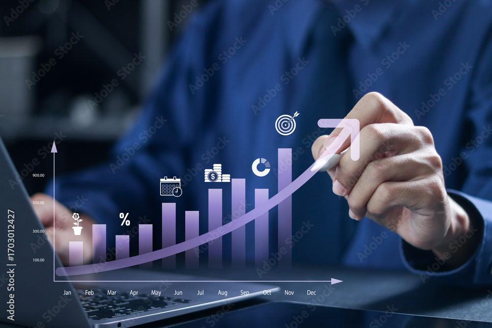 Investing for financial growth concept. Increase in income and wages, financial growth, improvement of economy, profitability of investment portfolio. Businessman use laptop with virtual chart. Investing for financial growth concept. Increase in income and wages, financial growth, improvement of economy, profitability of investment portfolio. Businessman use laptop with virtual chart.