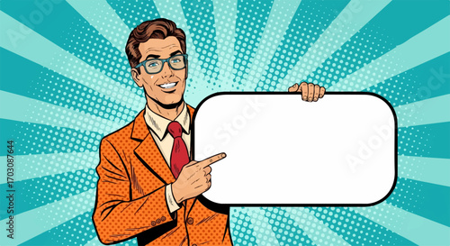 A smiling businessman in a stylish orange suit points to a blank sign against a vibrant pop art background, conveying a message of confident presentation.