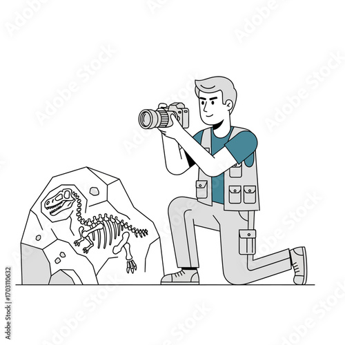 A man kneels taking a picture of a dinosaur skeleton fossilized in a rock formation.