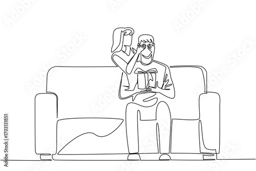 Continuous one line drawing a man sits on a sofa holding a gift box. The beloved wife gave a very interesting surprise. Romantic couple. Achieve. Surprise. Single line draw design vector illustration