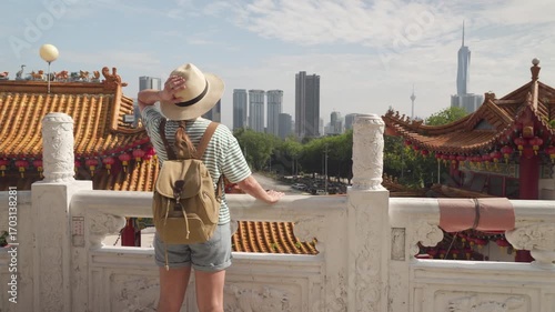 Female tourist is enjoying view of Kuala Lumpur, Malaysia